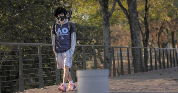 Man with mask walking